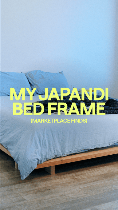 Low profile wooden bed frame with blue sheets